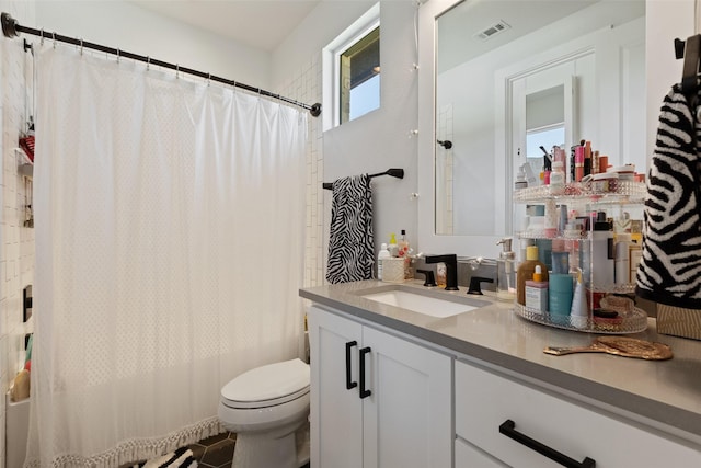 bathroom with shower / bath combo, visible vents, toilet, and vanity
