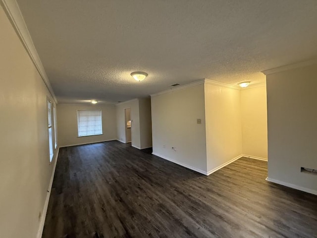 unfurnished room featuring ornamental molding, a textured ceiling, and dark wood-style flooring