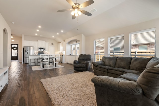 living area featuring visible vents, a ceiling fan, recessed lighting, dark wood-style flooring, and vaulted ceiling