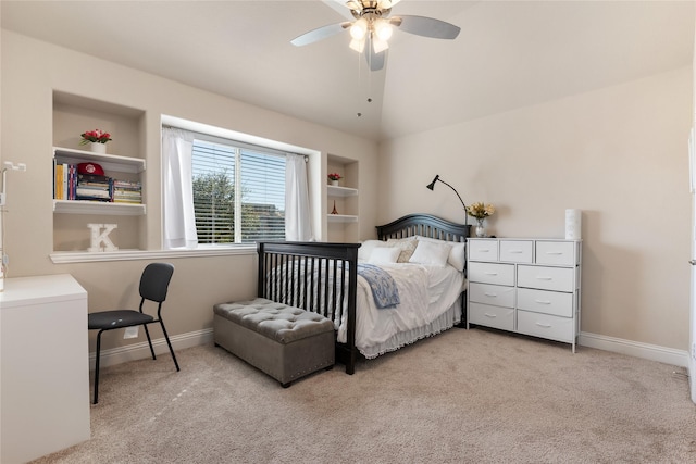 bedroom with baseboards, carpet floors, ceiling fan, and vaulted ceiling