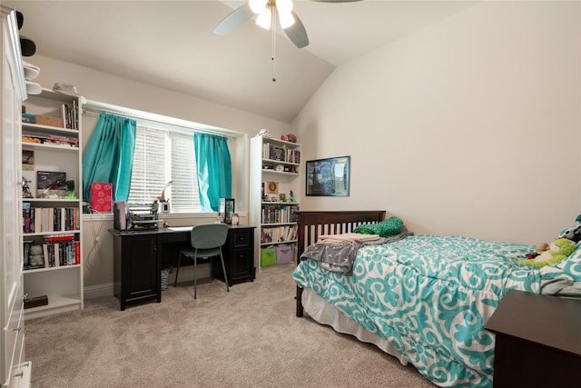 bedroom with lofted ceiling, a ceiling fan, and carpet flooring