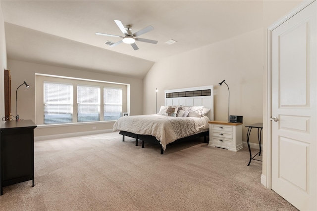 bedroom featuring baseboards, visible vents, light carpet, and lofted ceiling