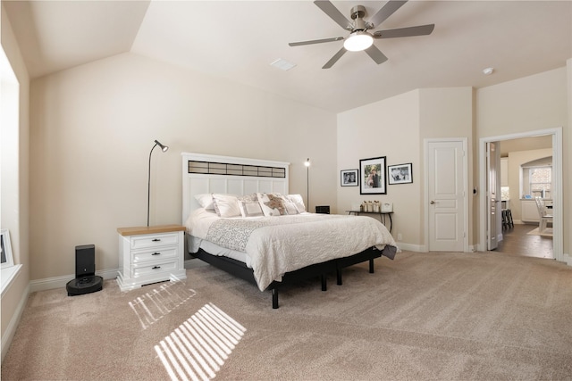 bedroom featuring baseboards, lofted ceiling, ceiling fan, and carpet flooring