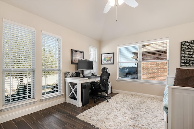 office space with vaulted ceiling, dark wood-style flooring, a wealth of natural light, and ceiling fan