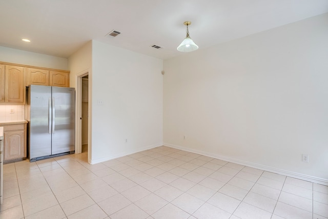 spare room featuring light tile patterned floors, visible vents, baseboards, and recessed lighting