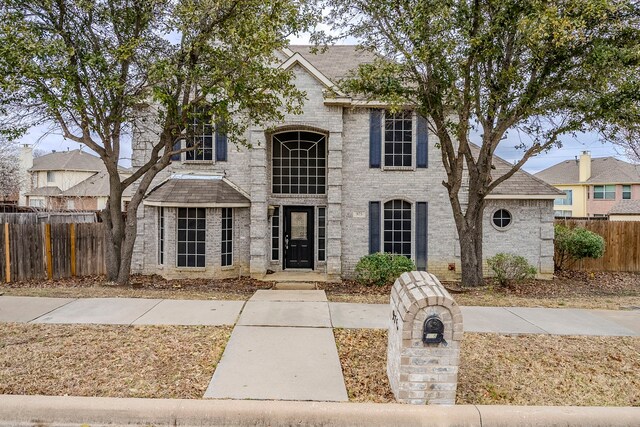 975 W Corporate Dr, Lewisville, TX 75067 - view of front of house with brick siding and fence