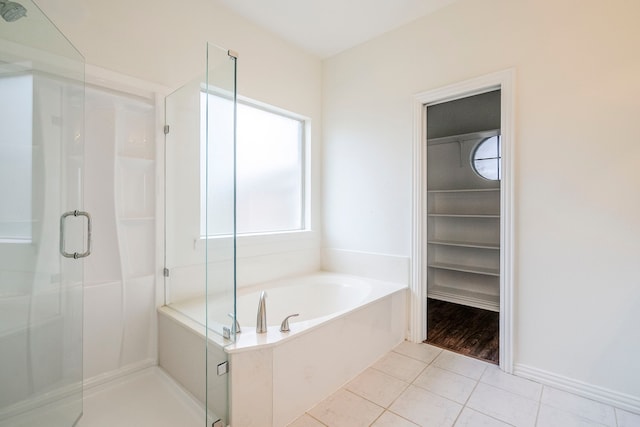 975 W Corporate Dr, Lewisville, TX 75067 - full bath featuring tile patterned floors, a bath, and a shower stall