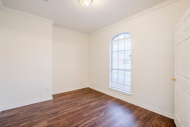 empty room with baseboards, dark wood-style floors, and ornamental molding