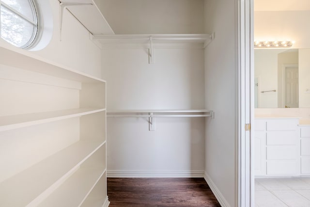 975 W Corporate Dr, Lewisville, TX 75067 - walk in closet featuring wood finished floors