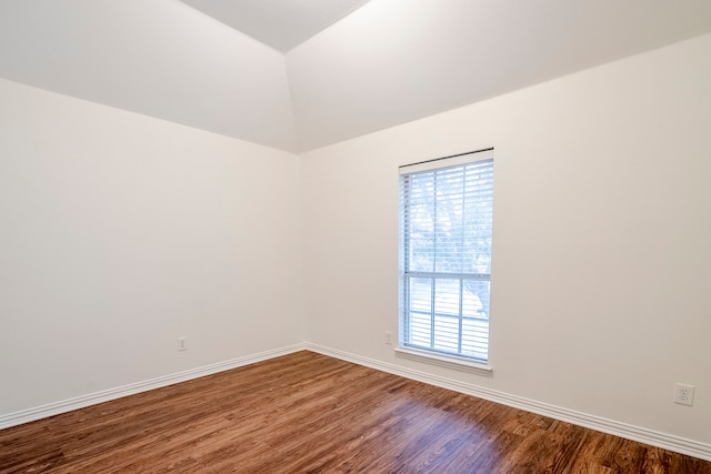 975 W Corporate Dr, Lewisville, TX 75067 - empty room with baseboards, lofted ceiling, and wood finished floors