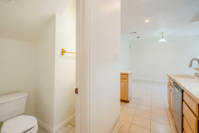 bathroom featuring visible vents, baseboards, toilet, tile patterned floors, and vanity