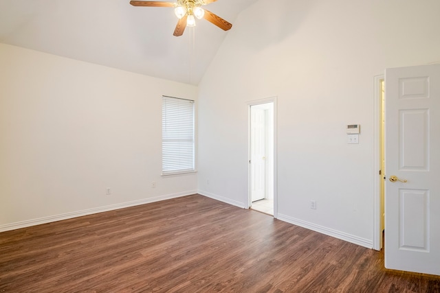 spare room featuring ceiling fan, baseboards, high vaulted ceiling, and dark wood-style floors