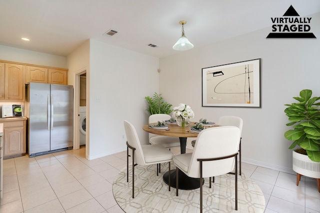 975 W Corporate Dr, Lewisville, TX 75067 - dining room with light tile patterned flooring, washer / dryer, baseboards, and visible vents