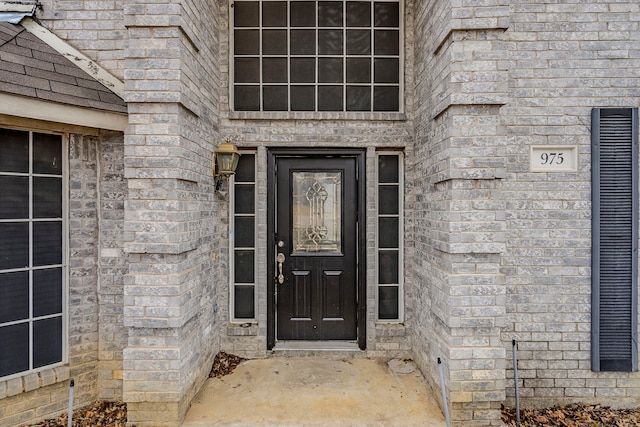 entrance to property with brick siding