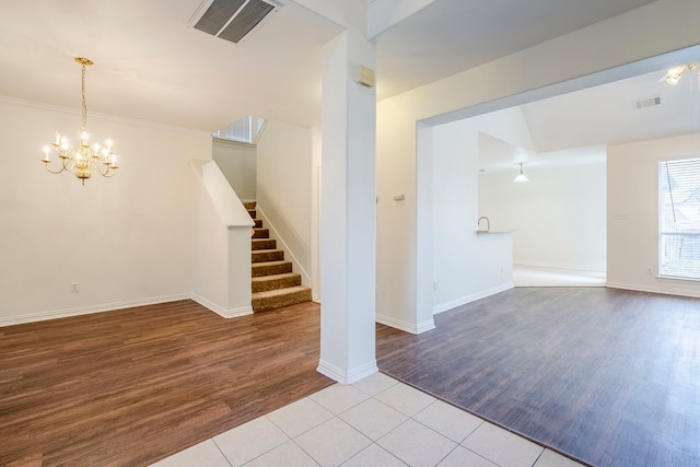 975 W Corporate Dr, Lewisville, TX 75067 - unfurnished living room with stairs, visible vents, and wood finished floors
