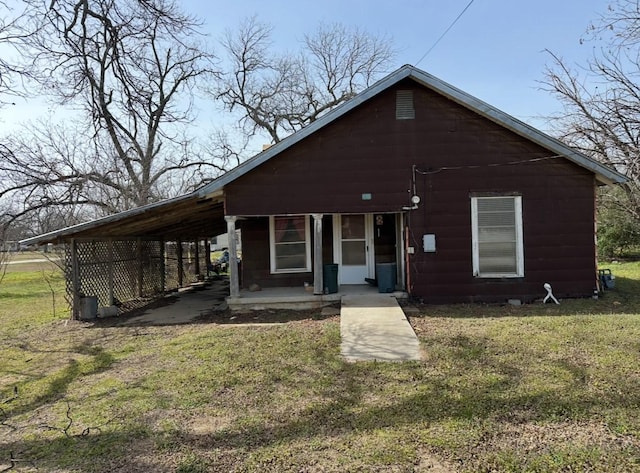 view of front of home with a porch and a front yard