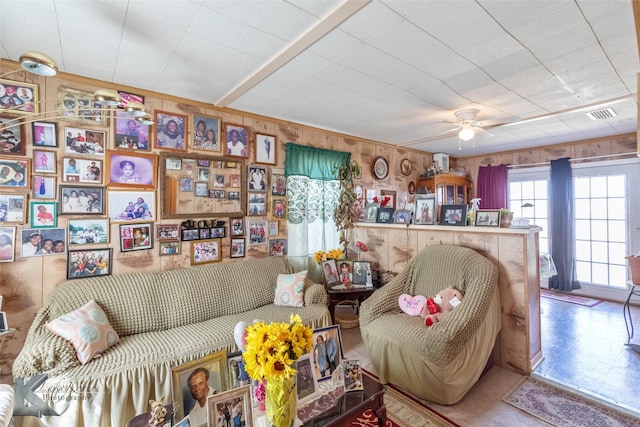 living room featuring visible vents and ceiling fan