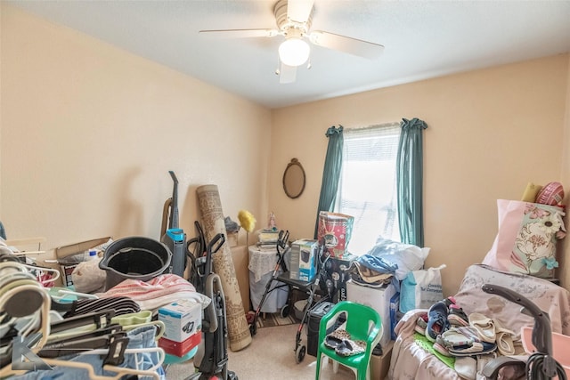 interior space with carpet floors and ceiling fan