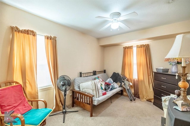 bedroom featuring ceiling fan and light carpet