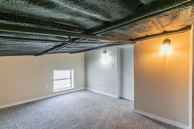 basement with baseboards and carpet floors