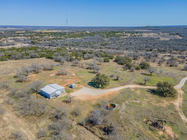 birds eye view of property featuring a rural view