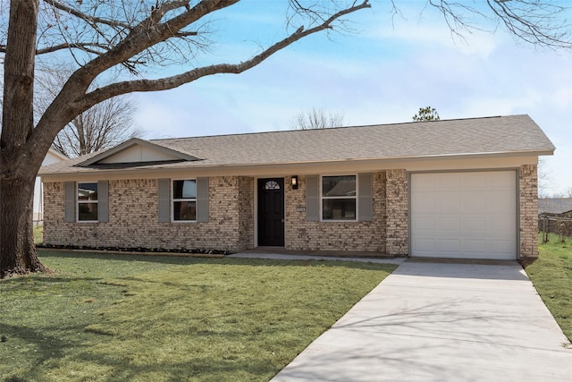 single story home with a front yard, roof with shingles, an attached garage, concrete driveway, and brick siding