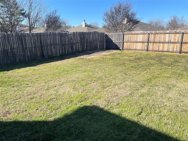 view of yard featuring a fenced backyard