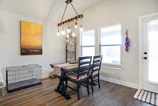 dining area with dark wood finished floors and baseboards