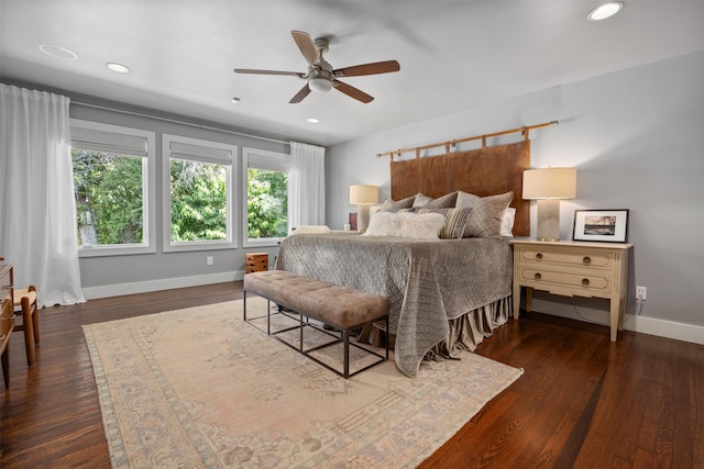 bedroom featuring recessed lighting, baseboards, and wood finished floors