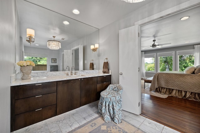 ensuite bathroom with vanity, ensuite bath, plenty of natural light, and recessed lighting