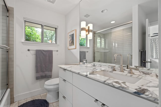 full bath with vanity, baseboards, visible vents, tile patterned floors, and toilet