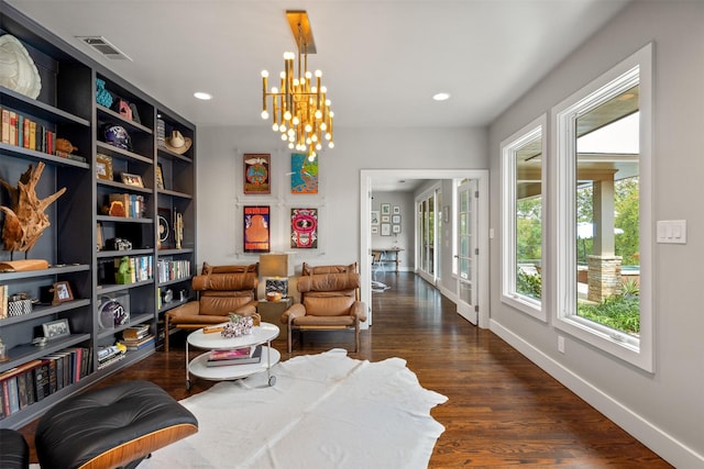 living area featuring baseboards, visible vents, an inviting chandelier, recessed lighting, and dark wood-type flooring