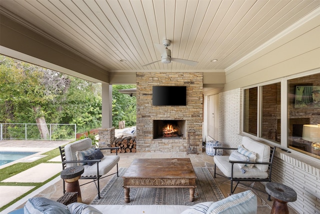 view of patio featuring an outdoor living space with a fireplace, a fenced in pool, and ceiling fan