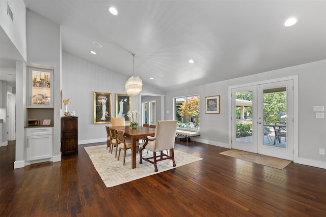 dining space featuring vaulted ceiling, french doors, visible vents, and dark wood-style flooring