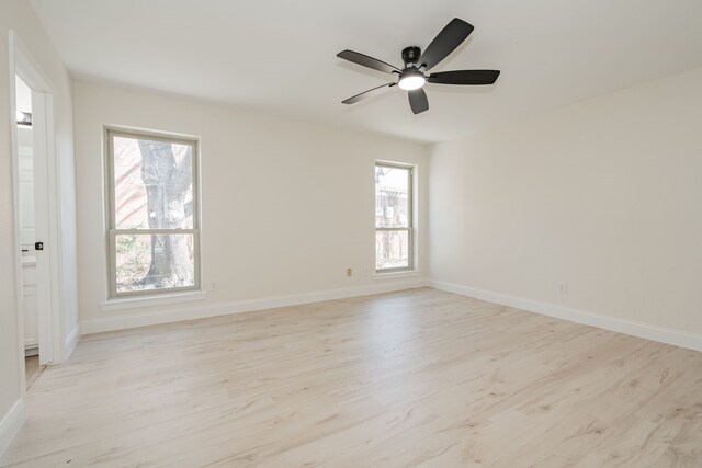 4110 Starboard Trl, Rowlett, TX 75088 - unfurnished room featuring light wood finished floors, baseboards, and ceiling fan