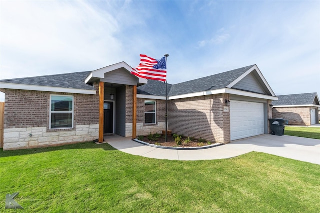 view of front of home with a front yard, an attached garage, brick siding, and concrete driveway