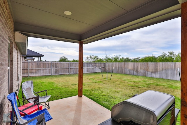 view of yard with a fenced backyard and a patio area