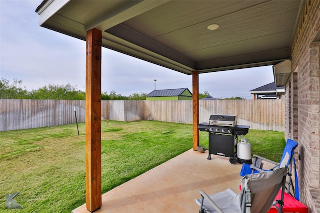 view of patio / terrace with area for grilling and a fenced backyard