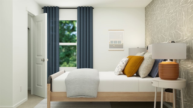 bedroom featuring an accent wall and carpet flooring