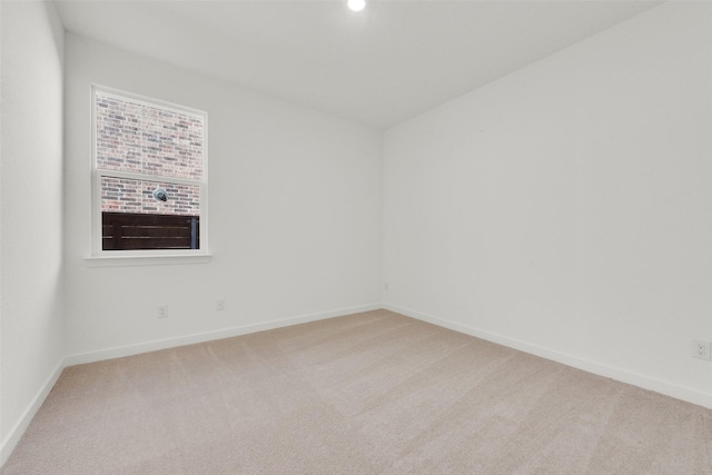 empty room with recessed lighting, baseboards, and light carpet