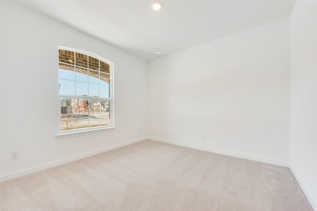 carpeted empty room with recessed lighting and baseboards