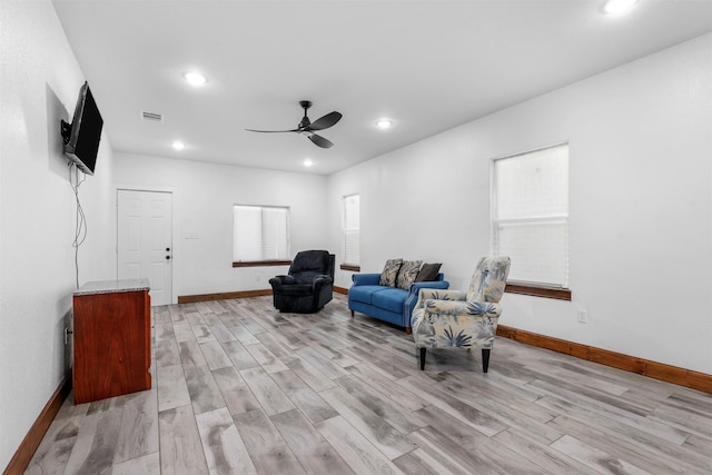 sitting room with baseboards, visible vents, recessed lighting, ceiling fan, and light wood-type flooring