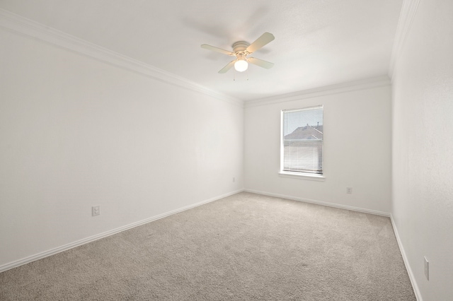 unfurnished room with crown molding, a ceiling fan, baseboards, and light carpet