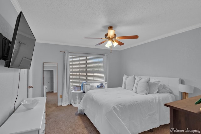 carpeted bedroom with a textured ceiling, ceiling fan, and ornamental molding