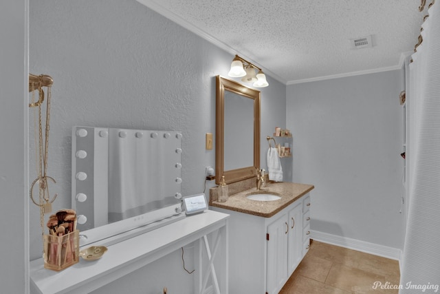 bathroom with tile patterned floors, visible vents, a textured ceiling, crown molding, and vanity