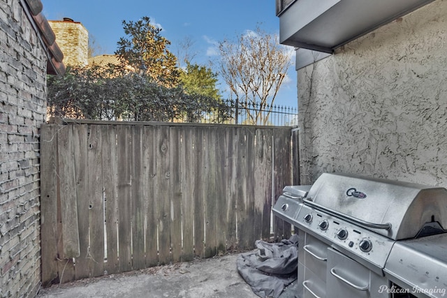 view of patio / terrace featuring fence