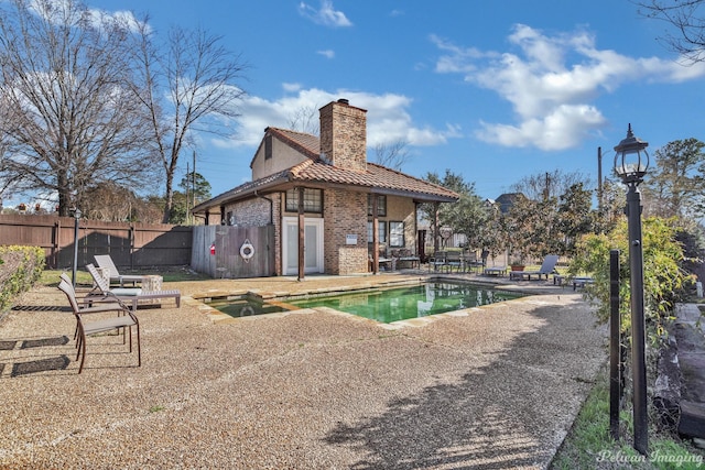 view of pool featuring a fenced in pool, fence, and a patio area