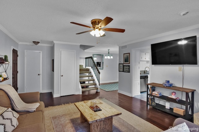 living area with visible vents, dark wood finished floors, stairs, and ornamental molding