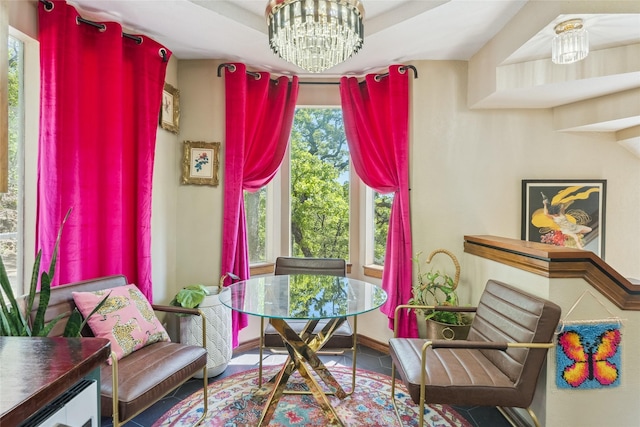living area featuring a notable chandelier