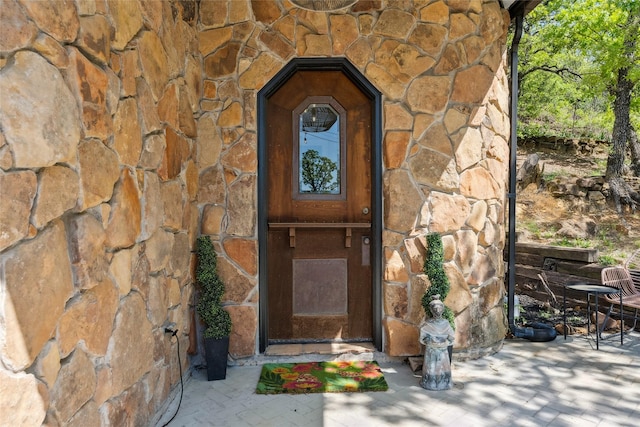entrance to property with stone siding